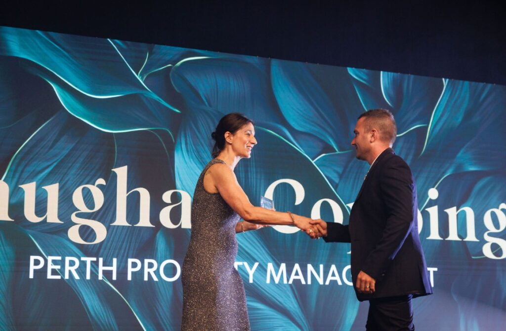 Vaughan Copping, Director of Property Management, accepting the REIWA Excellence award 